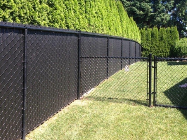 Black Chain with Black Privacy Slats Installed in Backyard For Added Privacy
